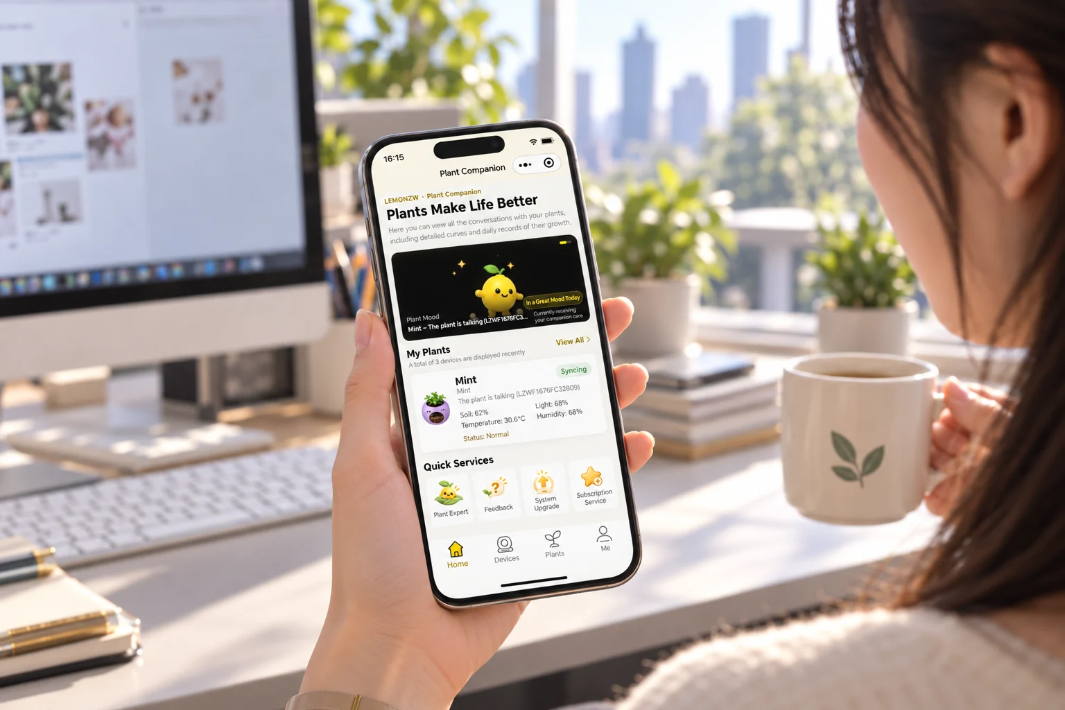 At her office desk in the morning light, she checks the Whisplant app on her phone — Mint's mood, soil moisture and temperature at a glance
